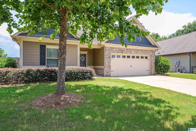 4955 Stonecreek Way, Calera, AL 35040 - view of front facade with brick siding, a garage, concrete driveway, and a front yard