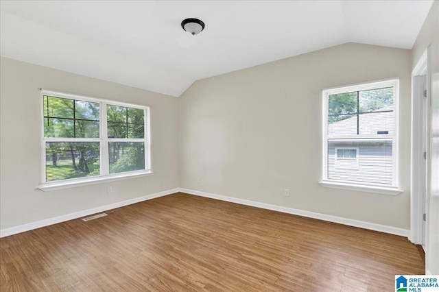 1324 Fulton Ave SW, Birmingham, AL 35211 - empty room with vaulted ceiling and wood finished floors