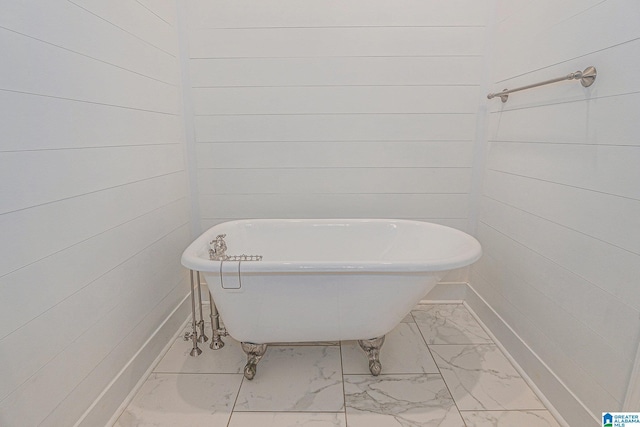 1813 Southpointe Cir, Hoover, AL 35244 - full bathroom featuring marble look tile flooring, a soaking tub, and wooden walls