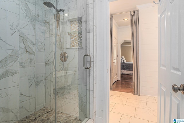 1813 Southpointe Cir, Hoover, AL 35244 - bathroom with marble look tiles, a shower stall, and connected bathroom