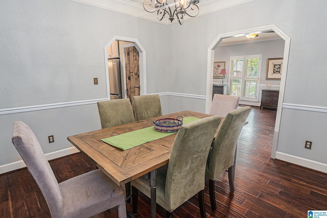 1813 Southpointe Cir, Hoover, AL 35244 - dining space with arched walkways, ornamental molding, a chandelier, and dark wood-type flooring