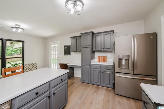 5904 Russet Meadows Way, Helena, AL 35244 - kitchen with stainless steel refrigerator with ice dispenser, gray cabinets, light wood-type flooring, and light countertops