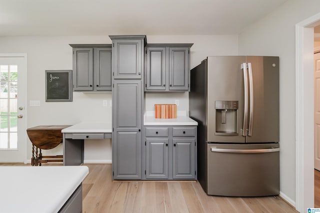 5904 Russet Meadows Way, Helena, AL 35244 - kitchen featuring stainless steel refrigerator with ice dispenser, gray cabinetry, light wood-type flooring, and light countertops