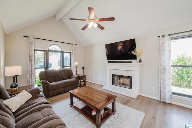 5904 Russet Meadows Way, Helena, AL 35244 - living area featuring ceiling fan, beam ceiling, a tiled fireplace, wood finished floors, and high vaulted ceiling