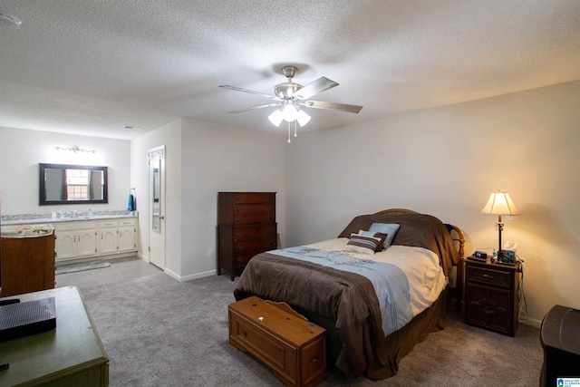 1822 Oakleaf Ln, Center Point, AL 35215 - bedroom with light colored carpet, connected bathroom, a textured ceiling, and ceiling fan