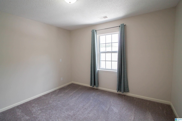 1822 Oakleaf Ln, Center Point, AL 35215 - carpeted empty room featuring a textured ceiling and baseboards