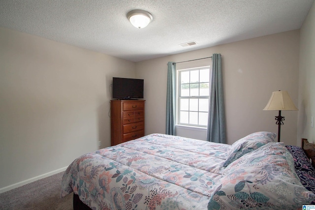 1822 Oakleaf Ln, Center Point, AL 35215 - carpeted bedroom featuring baseboards and a textured ceiling