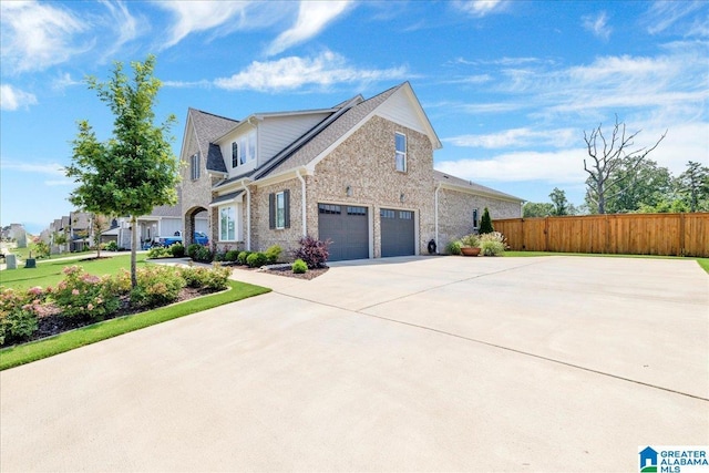 4549 Brexton St, Trussville, AL 35173 - view of side of property featuring a garage, brick siding, and concrete driveway
