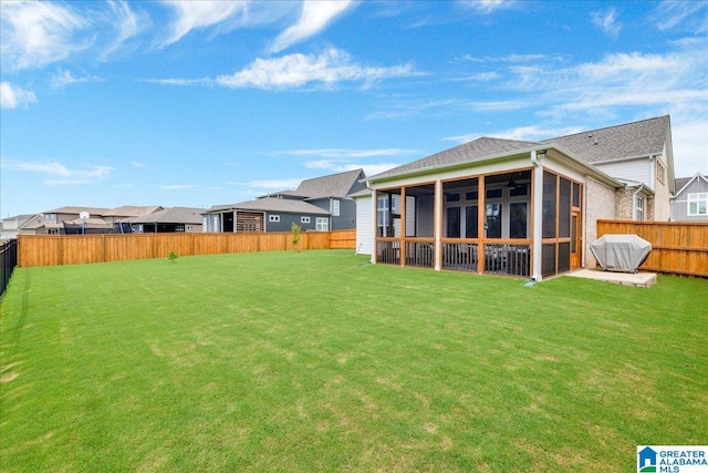 4549 Brexton St, Trussville, AL 35173 - fenced backyard featuring a sunroom, a ceiling fan, and a residential view