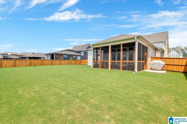 4549 Brexton St, Trussville, AL 35173 - rear view of house with a sunroom and a fenced backyard