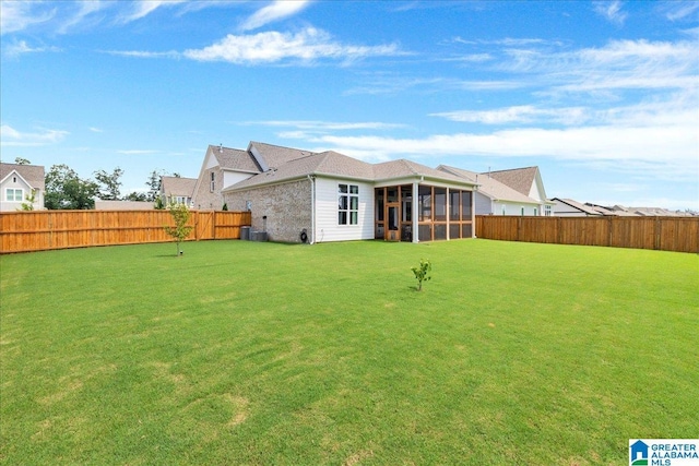 4549 Brexton St, Trussville, AL 35173 - rear view of property with a sunroom and a fenced backyard