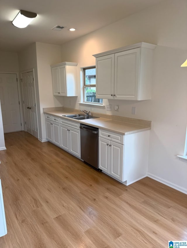 2312 Dunbar Cir, Moody, AL 35004 - kitchen with dishwasher, light wood-type flooring, light countertops, white cabinets, and recessed lighting