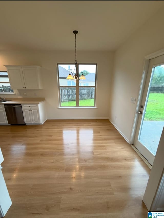 2312 Dunbar Cir, Moody, AL 35004 - unfurnished dining area featuring a chandelier and light wood-style flooring