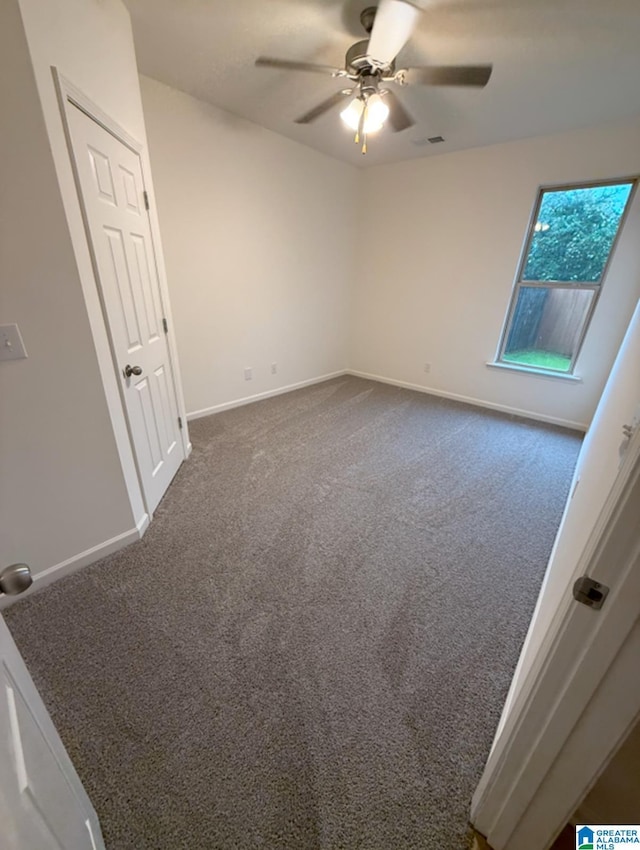 2312 Dunbar Cir, Moody, AL 35004 - spare room with ceiling fan and dark colored carpet