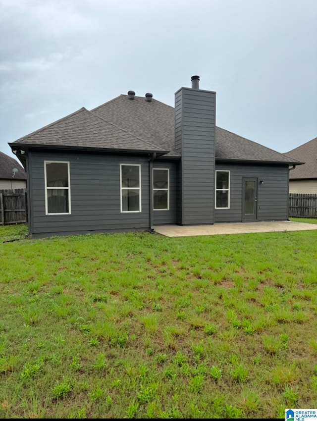 2312 Dunbar Cir, Moody, AL 35004 - rear view of house featuring a patio, a chimney, and roof with shingles