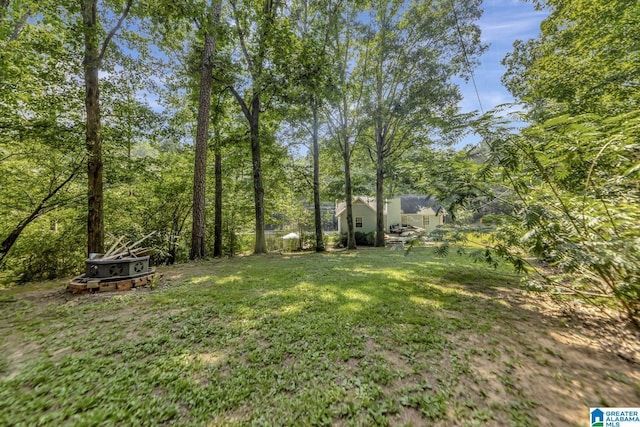 7839 Old Bradford Rd, Pinson, AL 35126 - view of grassy yard with a fire pit