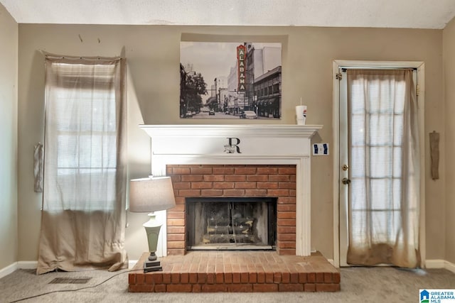 7839 Old Bradford Rd, Pinson, AL 35126 - carpeted living room with a brick fireplace and baseboards