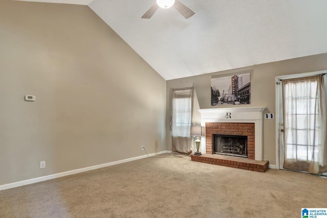 7839 Old Bradford Rd, Pinson, AL 35126 - unfurnished living room featuring a ceiling fan, carpet floors, a fireplace, plenty of natural light, and high vaulted ceiling