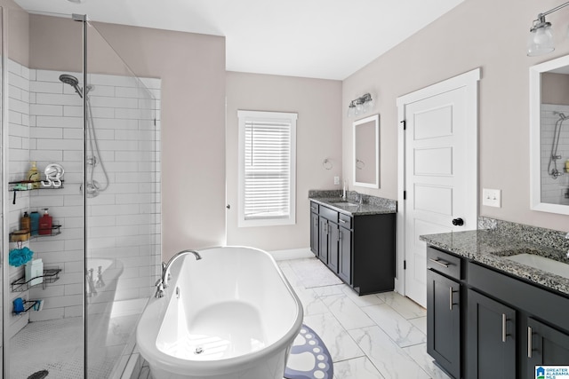 2024 Adams Ridge Dr, Chelsea, AL 35043 - bathroom with a stall shower, two vanities, marble finish floors, and a freestanding bath