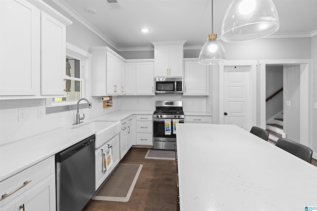2024 Adams Ridge Dr, Chelsea, AL 35043 - kitchen featuring appliances with stainless steel finishes, crown molding, decorative backsplash, white cabinets, and dark wood-style floors