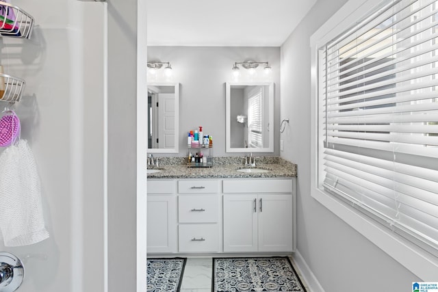 2024 Adams Ridge Dr, Chelsea, AL 35043 - bathroom with double vanity and marble look tiles
