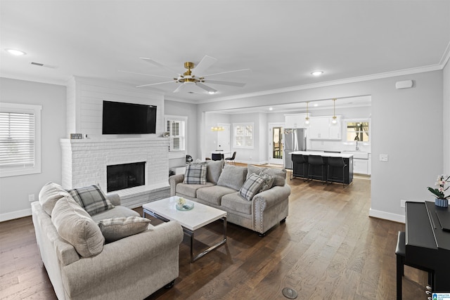2024 Adams Ridge Dr, Chelsea, AL 35043 - living room with ornamental molding, ceiling fan, a brick fireplace, plenty of natural light, and recessed lighting