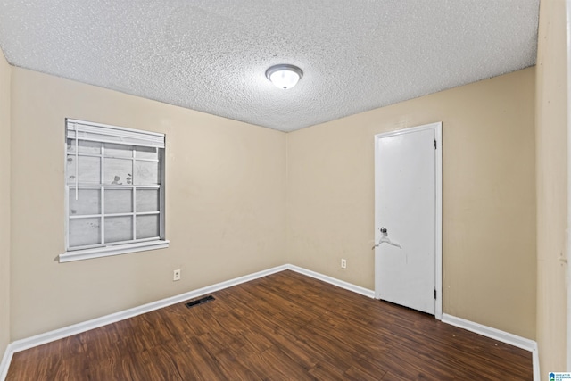 540 Harlem Ave, Hueytown, AL 35023 - spare room with wood finished floors and a textured ceiling