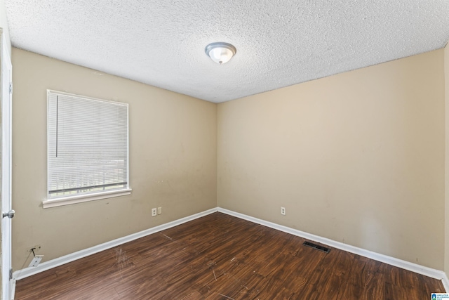 540 Harlem Ave, Hueytown, AL 35023 - spare room with wood finished floors and a textured ceiling