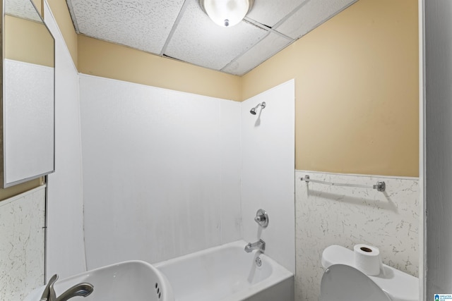 540 Harlem Ave, Hueytown, AL 35023 - bathroom with a drop ceiling, tub / shower combination, and wainscoting