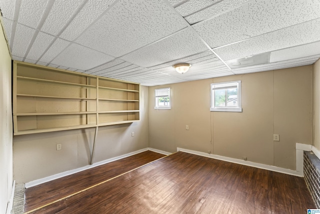 540 Harlem Ave, Hueytown, AL 35023 - below grade area with wood finished floors and a paneled ceiling