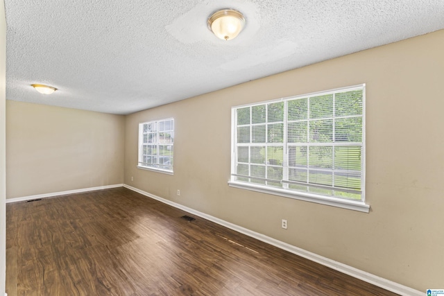540 Harlem Ave, Hueytown, AL 35023 - unfurnished room with wood finished floors and a textured ceiling