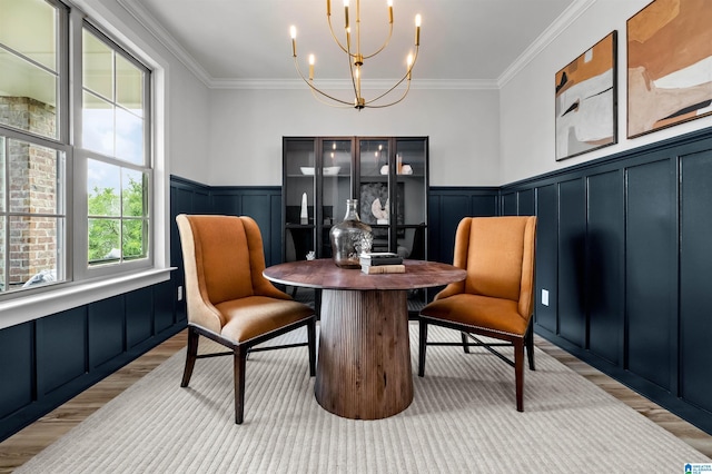 200 Simms Lndg, Pelham, AL 35124 - dining area featuring light wood-style floors, ornamental molding, a chandelier, a decorative wall, and wainscoting