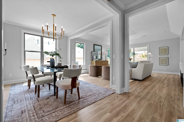 200 Simms Lndg, Pelham, AL 35124 - dining space with a chandelier, light wood finished floors, and crown molding
