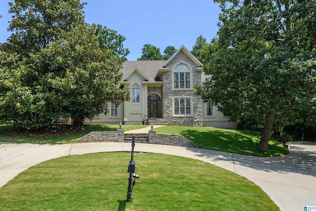 1616 Wingfield Trce, Birmingham, AL 35242 - view of front of house with a front yard, stone siding, and stucco siding