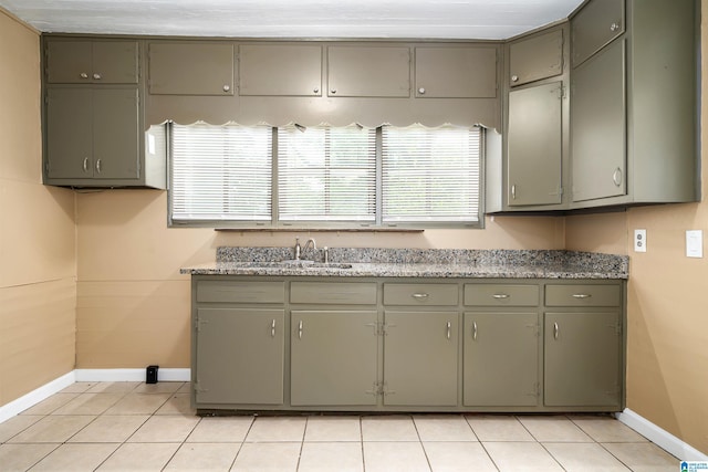 1221 4th Pl, Pleasant Grove, AL 35023 - kitchen with gray cabinetry and light tile patterned floors