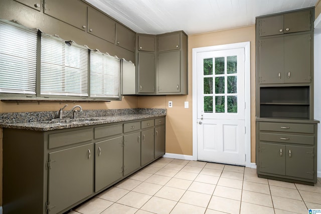 1221 4th Pl, Pleasant Grove, AL 35023 - kitchen with gray cabinets, light tile patterned flooring, and dark countertops