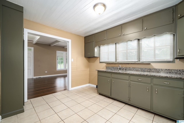 1221 4th Pl, Pleasant Grove, AL 35023 - kitchen with gray cabinetry, beamed ceiling, and light tile patterned floors