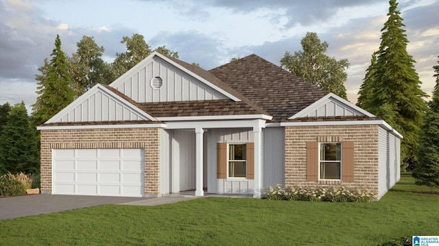 649 Fish Camp Rd, Chelsea, AL 35043 - view of front of property featuring brick siding, an attached garage, driveway, board and batten siding, and a front lawn