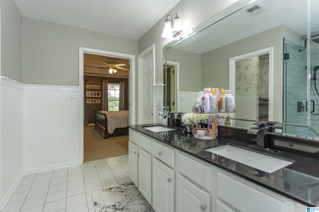 273 Forest Pkwy, Alabaster, AL 35007 - full bathroom with double vanity, tile patterned floors, a wainscoted wall, ensuite bathroom, and a shower with shower door