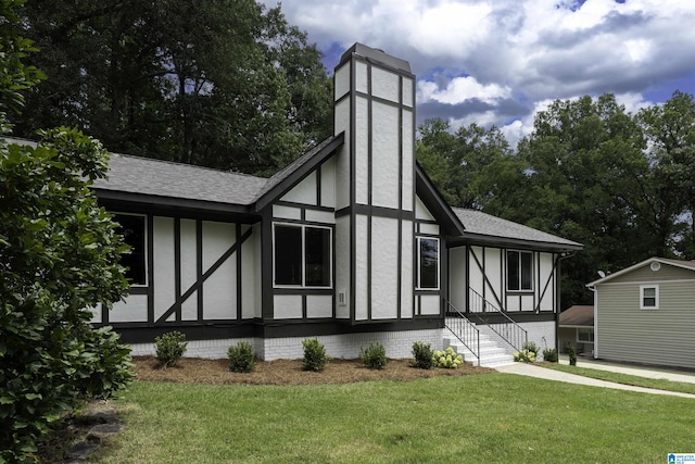 1228 Macqueen Dr, Helena, AL 35080 - view of side of home with a chimney, a yard, roof with shingles, and stucco siding