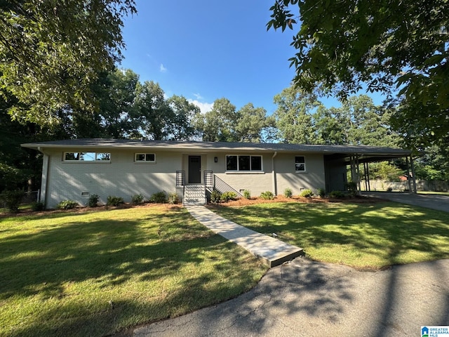7174 Rowan Rd, Leeds, AL 35094 - view of front of house with a front lawn and an attached carport