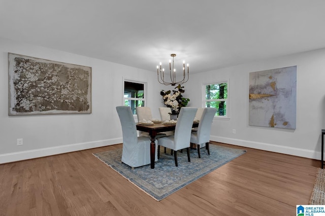 7174 Rowan Rd, Leeds, AL 35094 - dining space with a chandelier and wood finished floors