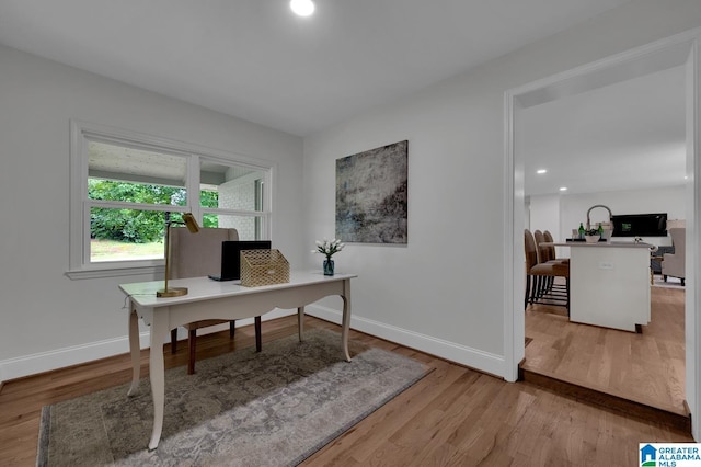 7174 Rowan Rd, Leeds, AL 35094 - home office featuring light wood-style flooring and recessed lighting