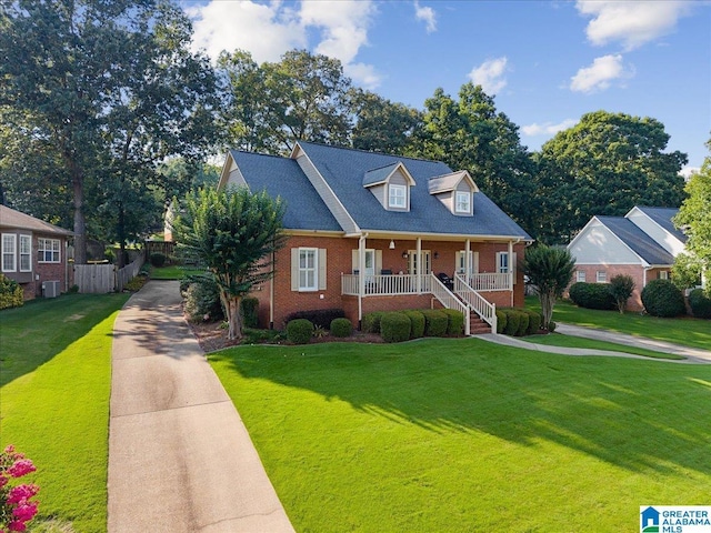 315 Roundabout Dr, Trussville, AL 35173 - cape cod house with a porch, brick siding, and driveway