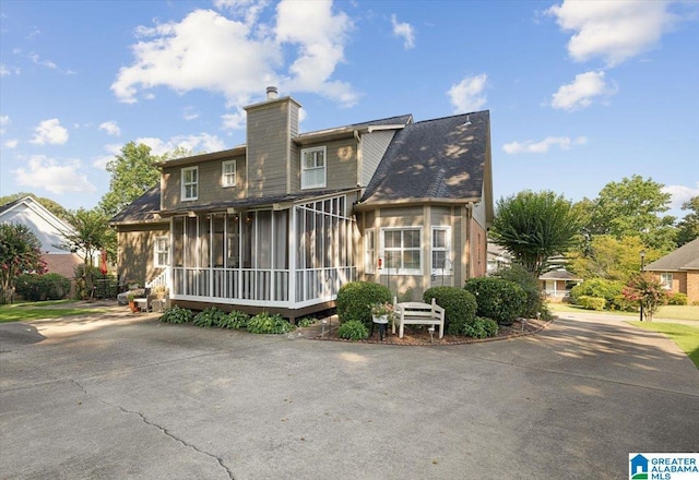 315 Roundabout Dr, Trussville, AL 35173 - rear view of property featuring a chimney and a sunroom