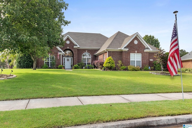 3037 Twelve Stones Rd SE, Owens Cross Roads, AL 35763 - traditional home featuring brick siding, a front yard, and a shingled roof
