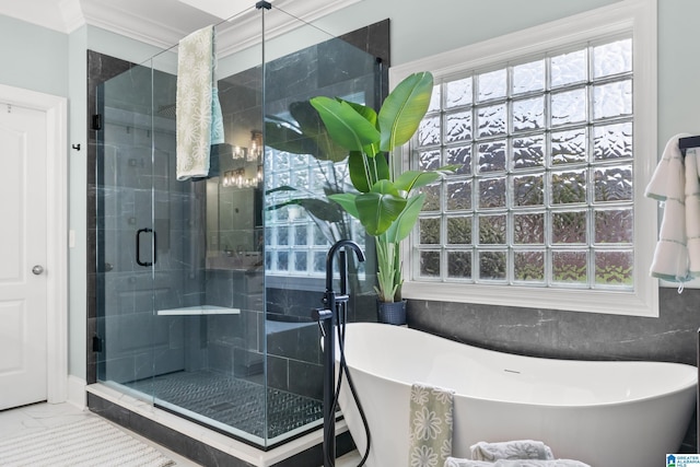 3037 Twelve Stones Rd SE, Owens Cross Roads, AL 35763 - full bathroom with a freestanding bath, a stall shower, marble look tiles, ornamental molding, and healthy amount of natural light