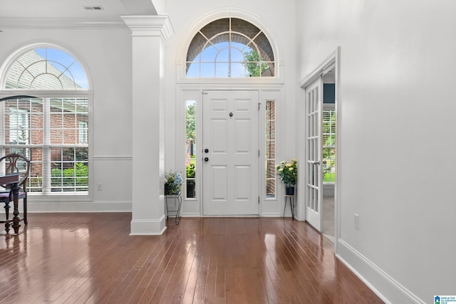 3037 Twelve Stones Rd SE, Owens Cross Roads, AL 35763 - entryway with wood-type flooring, healthy amount of natural light, a towering ceiling, and crown molding