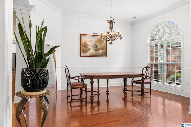 3037 Twelve Stones Rd SE, Owens Cross Roads, AL 35763 - dining space with ornamental molding, wood finished floors, and a chandelier