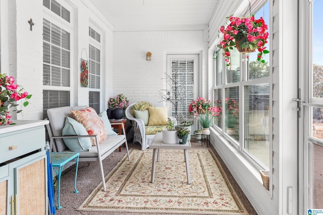 3037 Twelve Stones Rd SE, Owens Cross Roads, AL 35763 - sunroom with brick wall and an outdoor living space